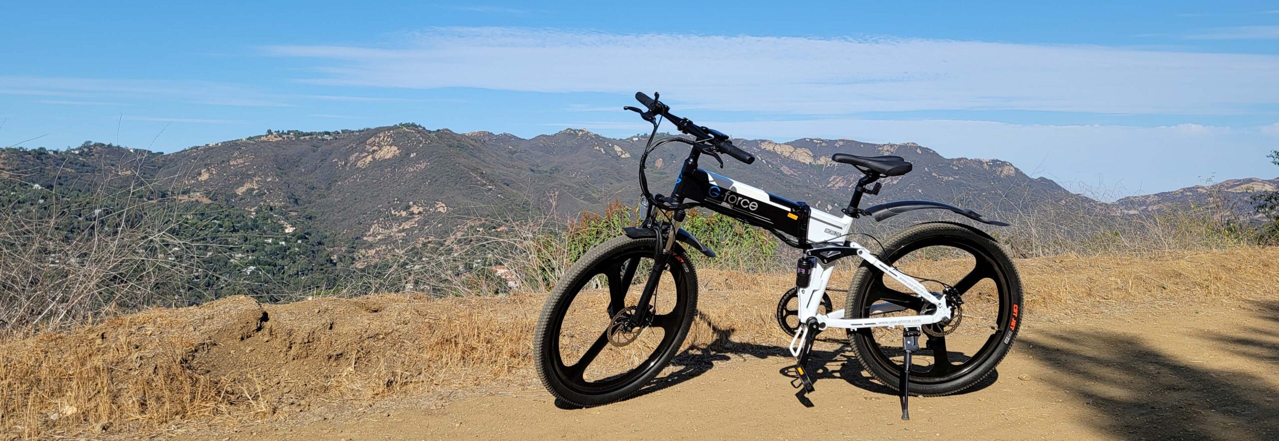 Electric Bike on Dirt Road in Mountains Electric Bike on Dirt Road in Mountains